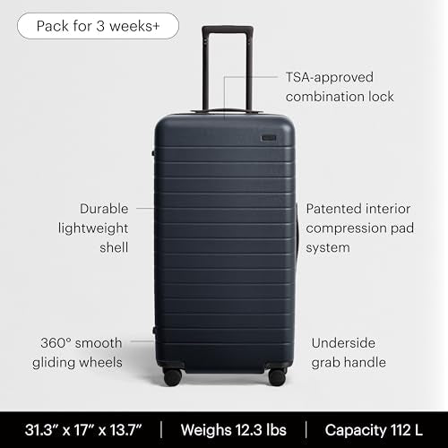 Away Trunk Checked Luggage - 31-Inch Lightweight Hardside Suitcase with 360° WhisperGlide Spinner Wheels, Interior Compression System, TSA-Accepted Lock - Navy Blue