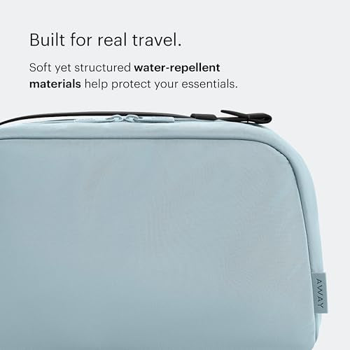 Away Amazon Exclusive Large Toiletry Bag - Water-Repellent Travel Toiletry Bag with Clamshell Opening, Interior Compartments, Exterior Zip Pocket - Sky Blue