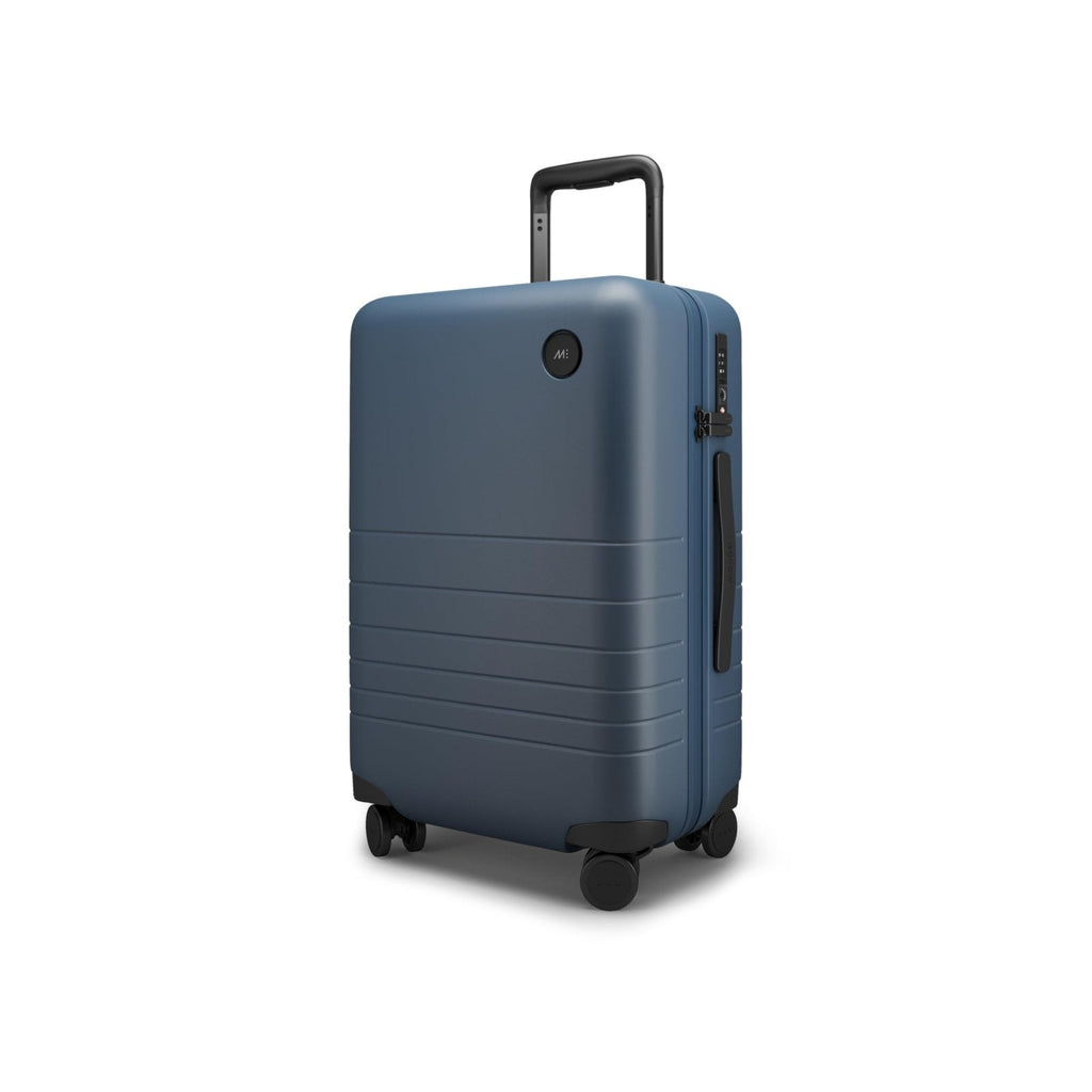 Monos Carry-On Plus Luggage (23"), Lightweight Hardside Spinner Suitcase with TSA Lock, Airline Approved, Ocean Blue