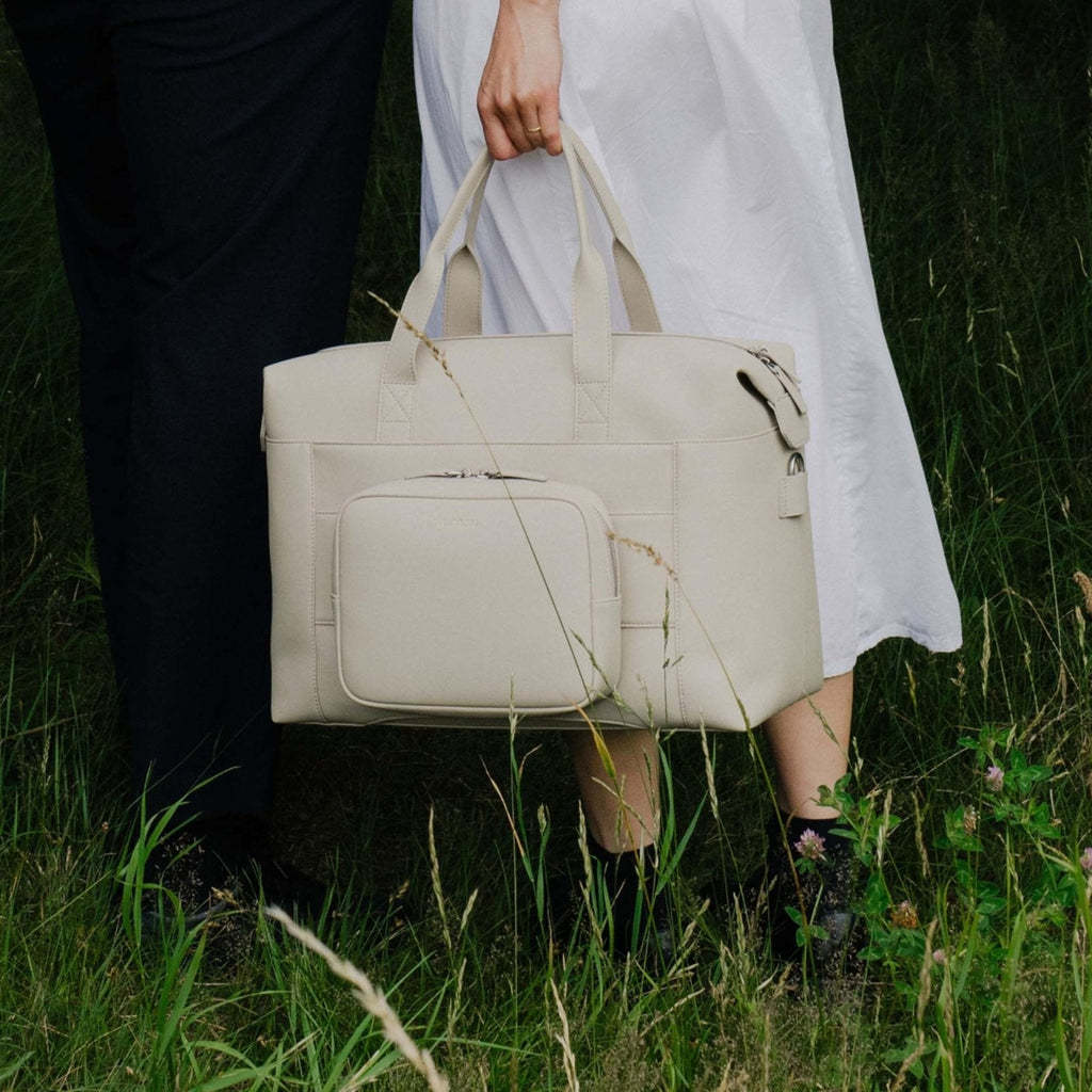 Monos Metro Duffel Vegan Leather Microfiber, Travel Duffel Bag & Weekender with Shoe Compartment, Carry - On Approved, Ivory
